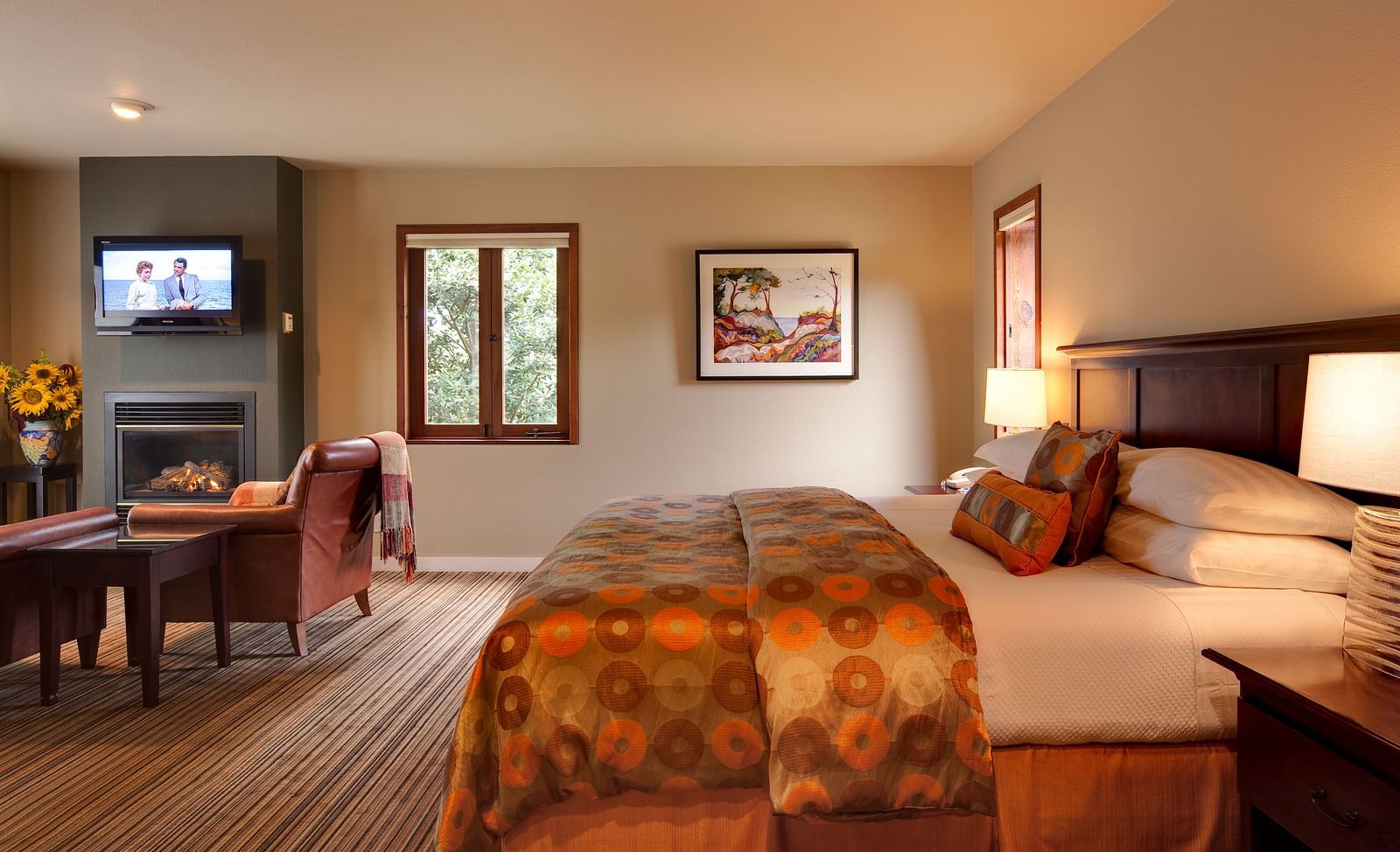 A spacious room in Mendocino with a big bed and scenic view from the window- Brewery Gulch Inn & Spa