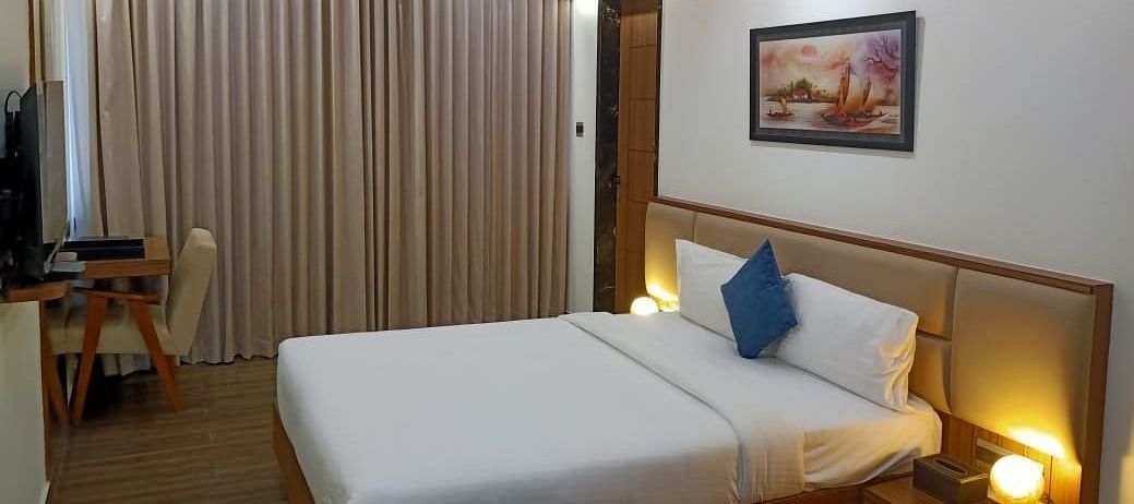 Executive room with double bed and modern amenities at TGI Felicity, Bangalore