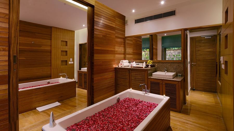 bathtub strewn with flower petals