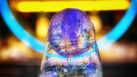 An elegant drink with a bright light displayed in the background at Cenneys Gateway - Pride of Salem.