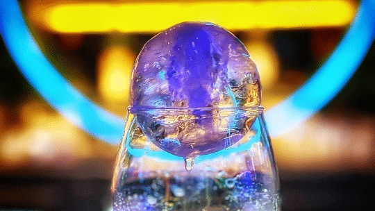 An elegant drink with a bright light displayed in the background at Cenneys Gateway.