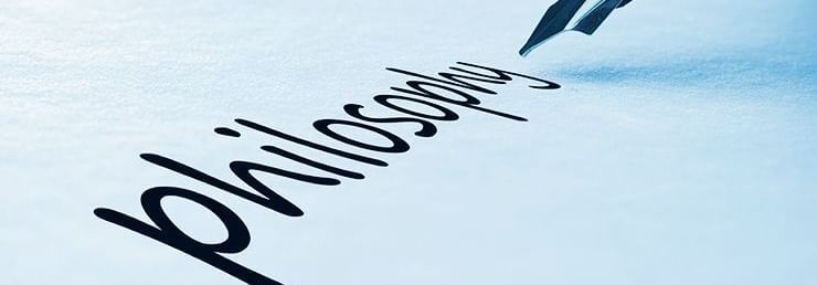 The word philosophy being written on a piece of paper