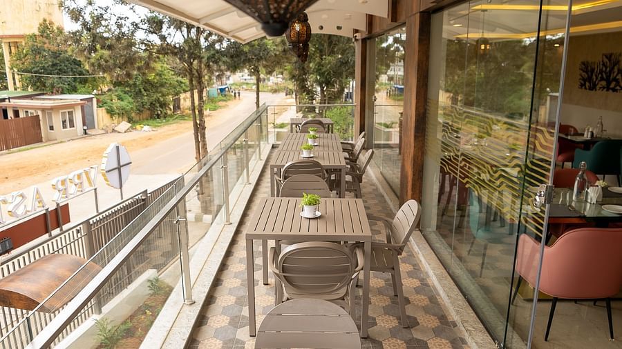 Picture of outdoor dining are with the tables and chairs arranged - VRR Astoria Hotel and Conventional Centre