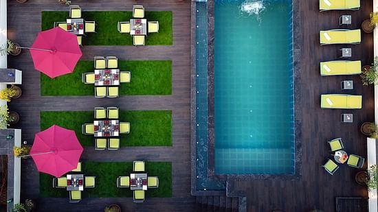 An aerial shot of our swimming pool with sun loungers on the side - Golden Tulip, Agra