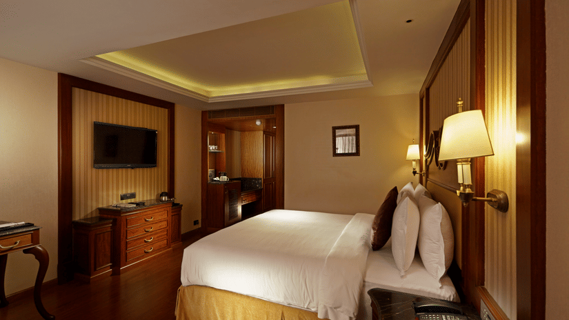 Room with a king size bed and elegant interiors at Hablis hotel Chennai.