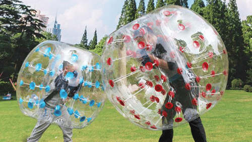 Two kids land zorbing on a garden - The Ananta Udaipur