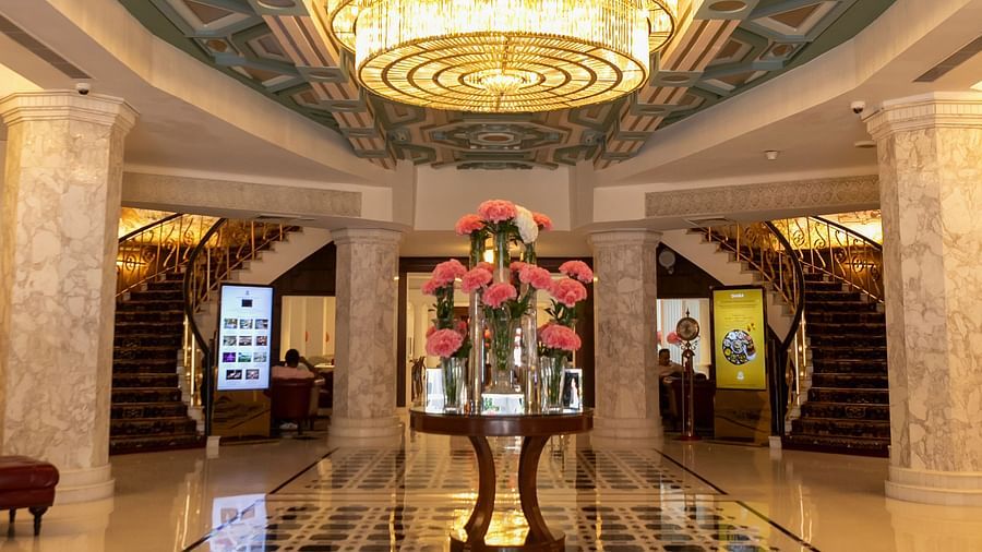 A lobby image of the The Claridges New Delhi with a chandelier hanging - Claridges Collection