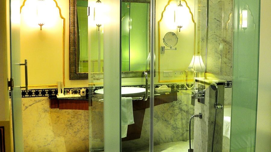 Image of a washroom with glass cubicle at Rajasthali Resort & Spa Jaipur.