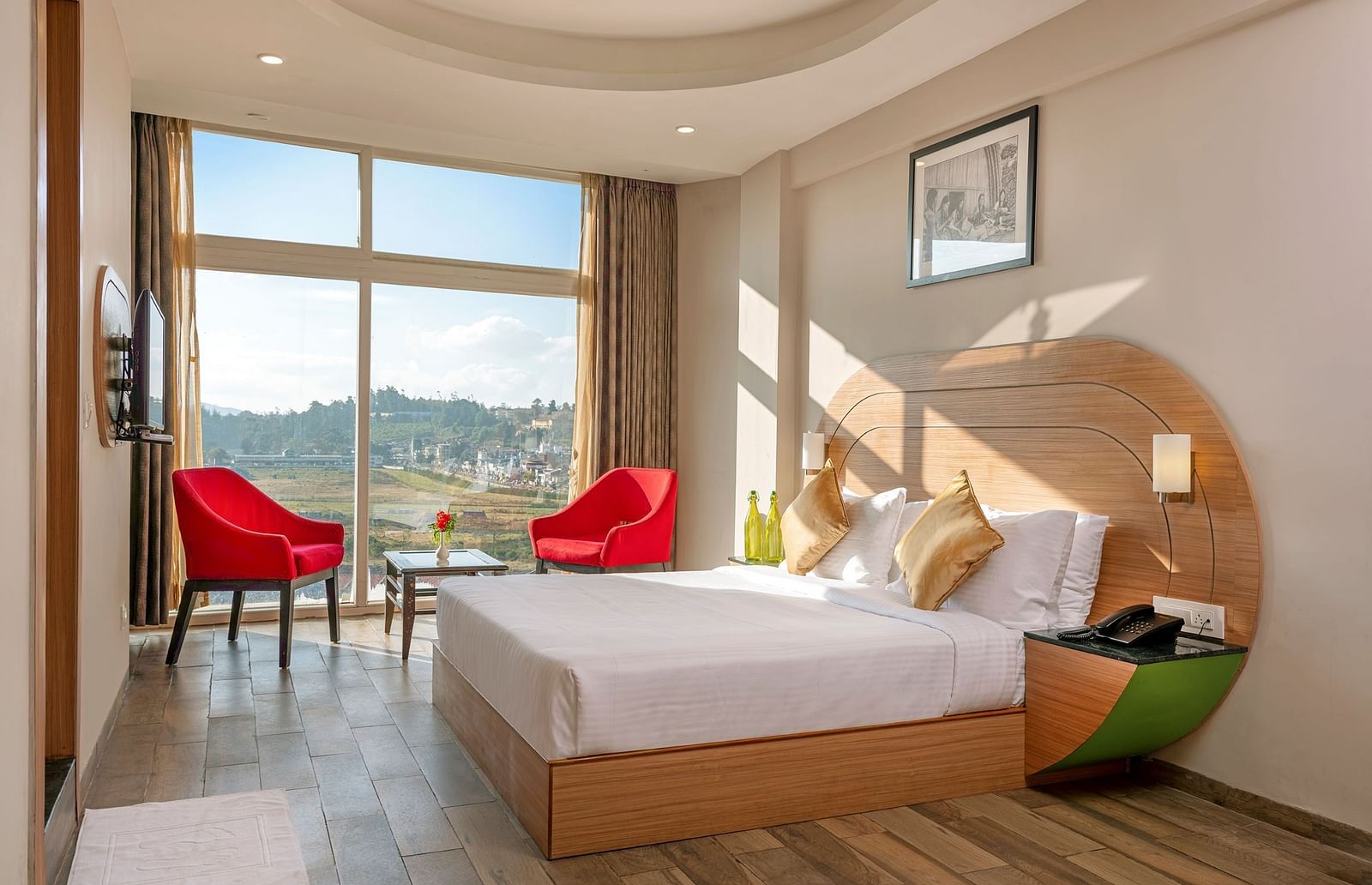 An image of a bedoom where natural light is seeping in through the glass window | Mango HIll Central, Ooty