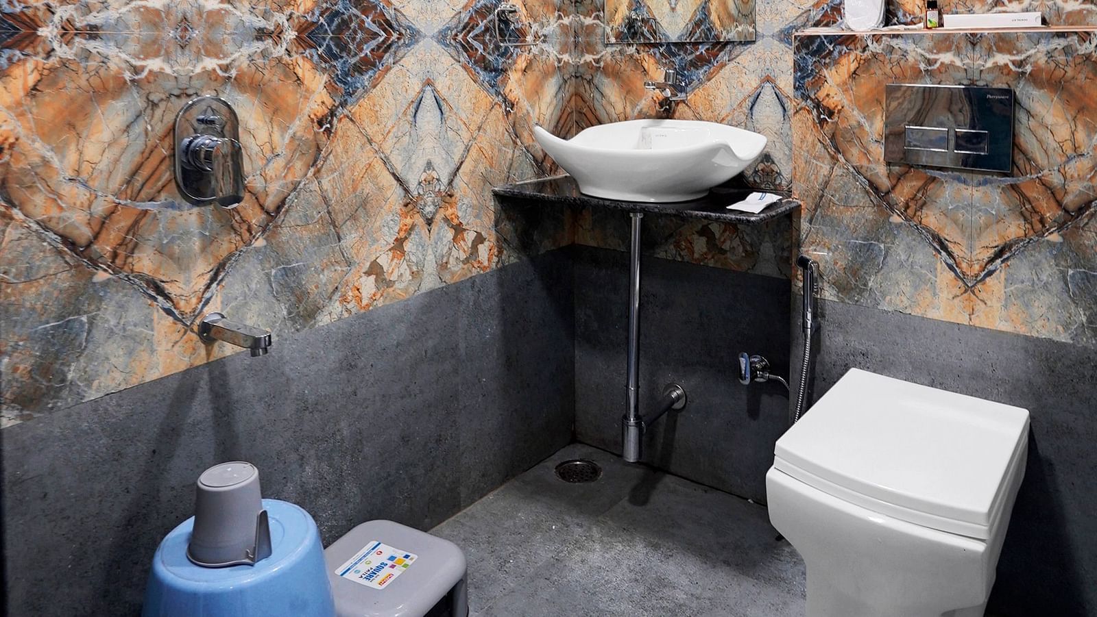 Vanity area of Deluxe Room at Hotel Regal Heaven, Pune.