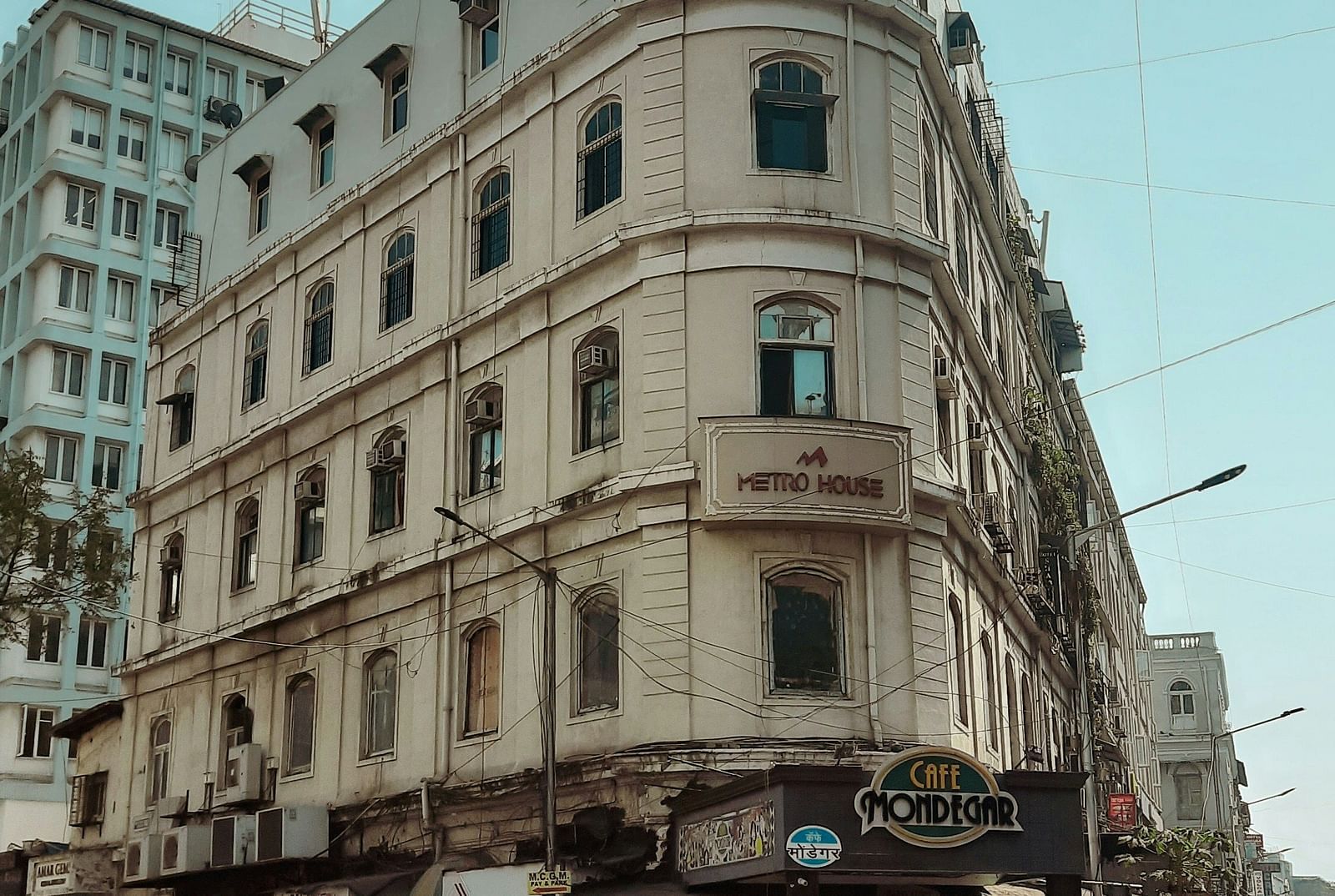 image featuring a building with a cafe in the ground floor at colaba causeway in mumbai