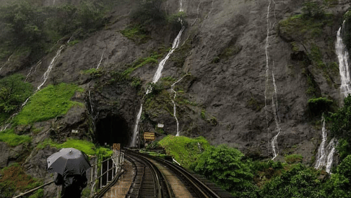 a waterfall cascading down a hill 4