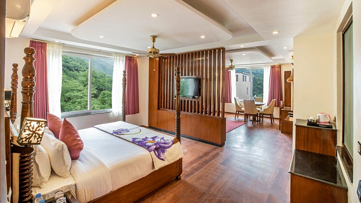 Corner view shot of the Suite with ample of natural light coming from the windows at Regenta Inn DLS.