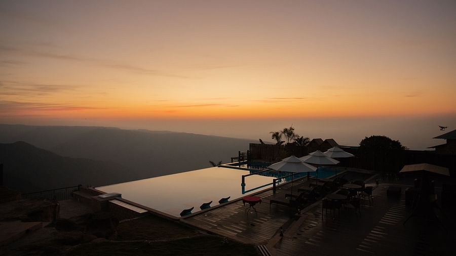 view of infinity pool during nighttime 2