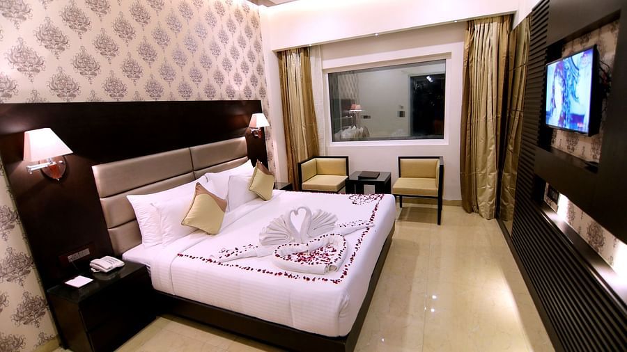 Deluxe Room features lush bedding and aesthetic walls 2 - Udman Hotel Haridwar