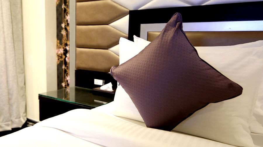 The white bedding and pillow at the Junior Suite - Theme Modern 4 - Udman Hotel Haridwar