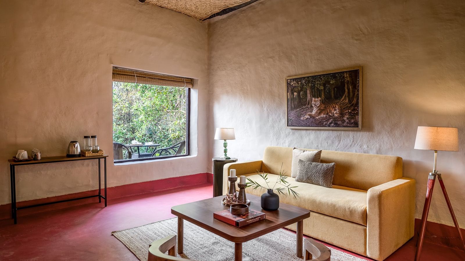Side view of the sofa in Mud House Suite at Saccharum Safari Lodge, Balaghat