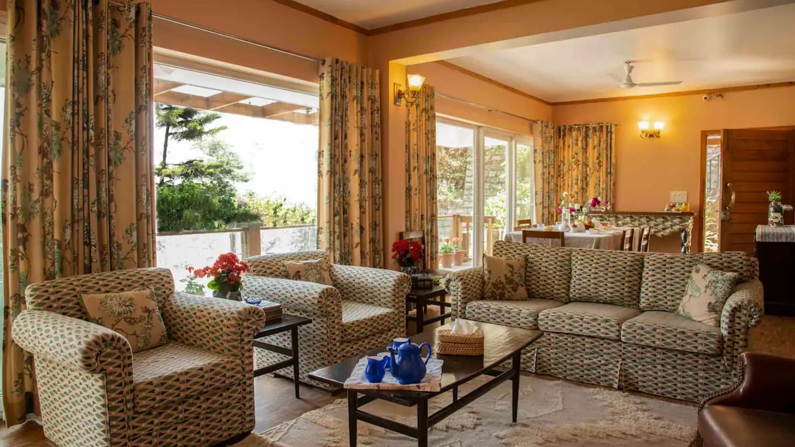 A cosy living area with comfortable sofas around a glass table  in 3 BHK at SOUTHGATE KASAULI BY ZENQ.
