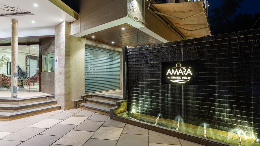 Image of the entrance of Calux Grand Inn, Calangute with Amara Grand Inn written on the wall.