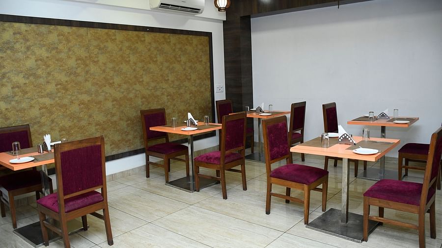 Indoor dining area with neatly arranged tables and chairs