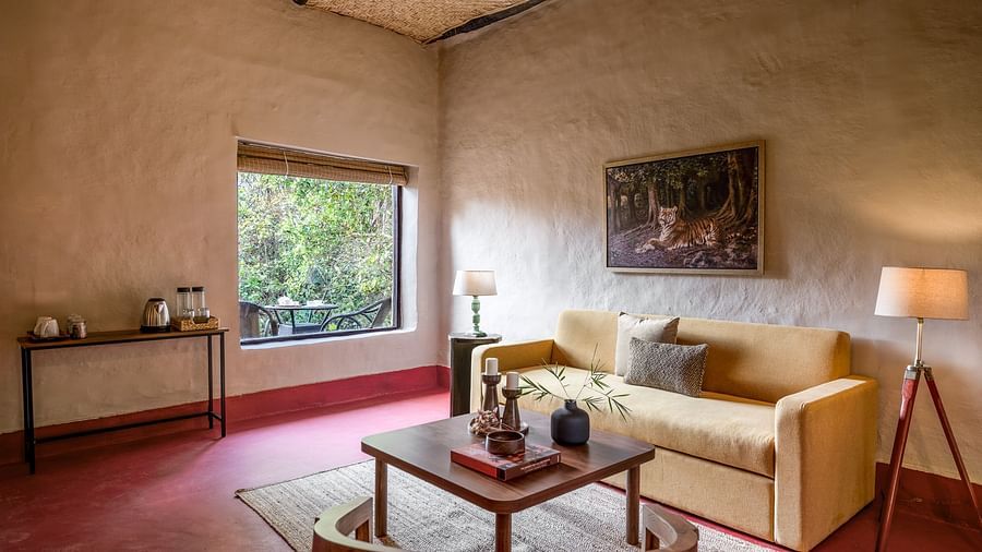 Side view of the sofa in Mud House Suite at Saccharum Safari Lodge, Balaghat