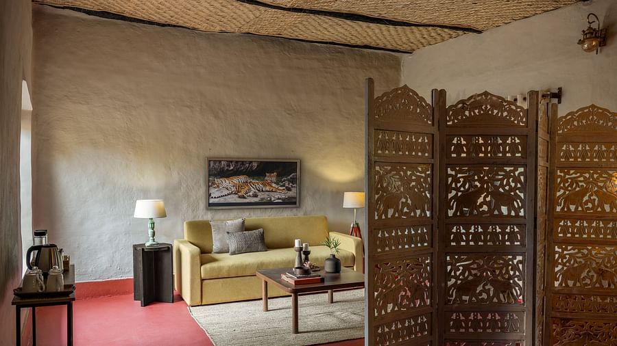 Living room in Mud House Suite at Saccharum Safari Lodge, Balaghat