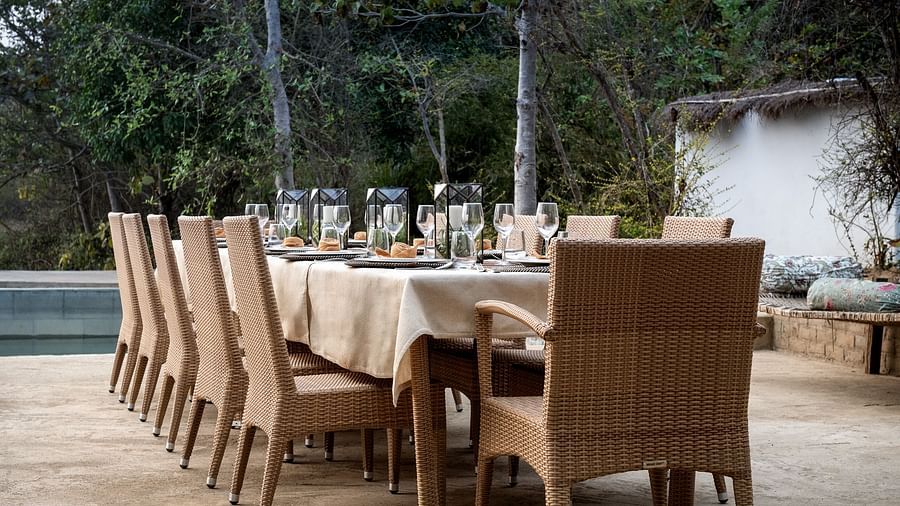 Side view of the dining setup near Swimming Pool at Saccharum Safari Lodge, Balaghat 