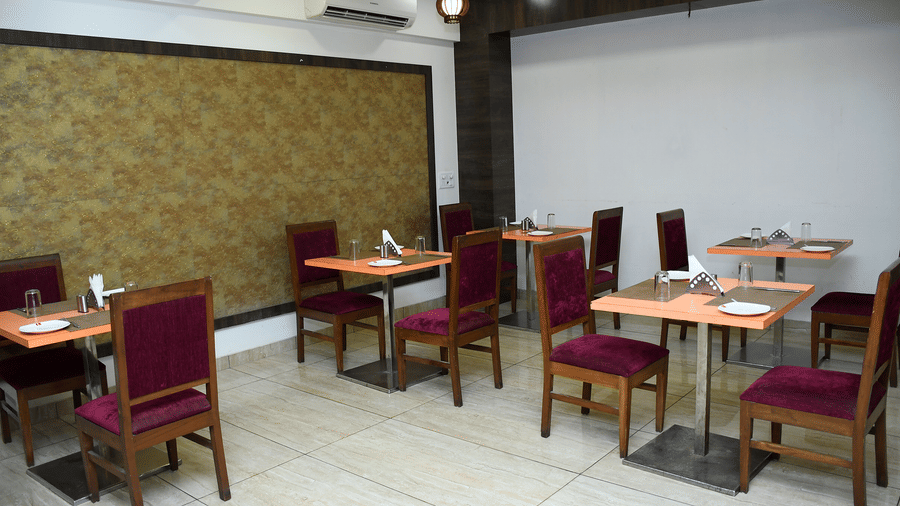 Indoor dining area with neatly arranged tables and chairs