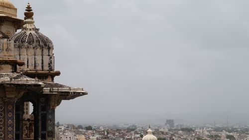 View of the Alwar city as seen from the ramparts of City Palace, showing urban landscape in the background.