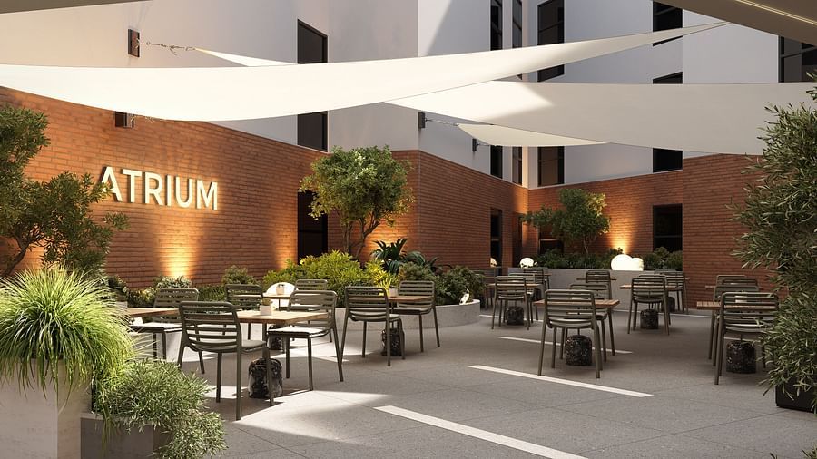 Comfortable dining seating at the Atrium at The Pelican Hotel, Accra.