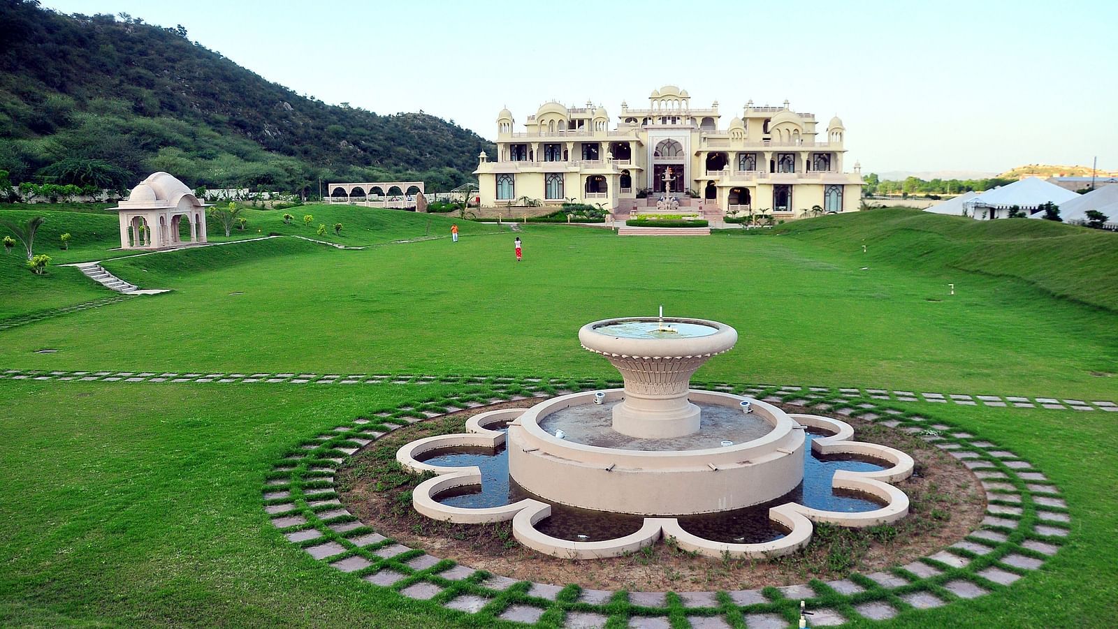 Image of Moriyo Lawn with a water fountain at Rajasthali Resort & Spa Jaipur.