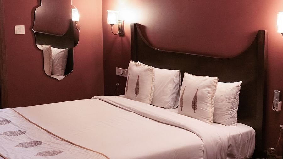 A bedroom with a double bed and side tables