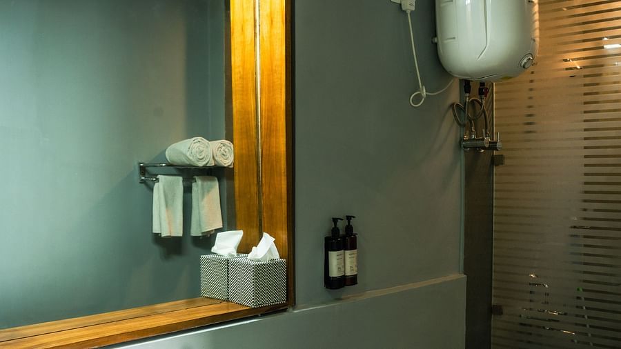 A bathroom featuring a geyser and toiletries at BluSalzz Escapade Resort, Lansdowne