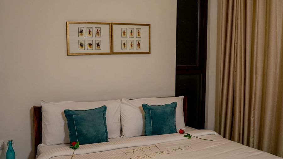 A bed with a printed bedsheet at BluSalzz Escapade Resort, Lansdowne