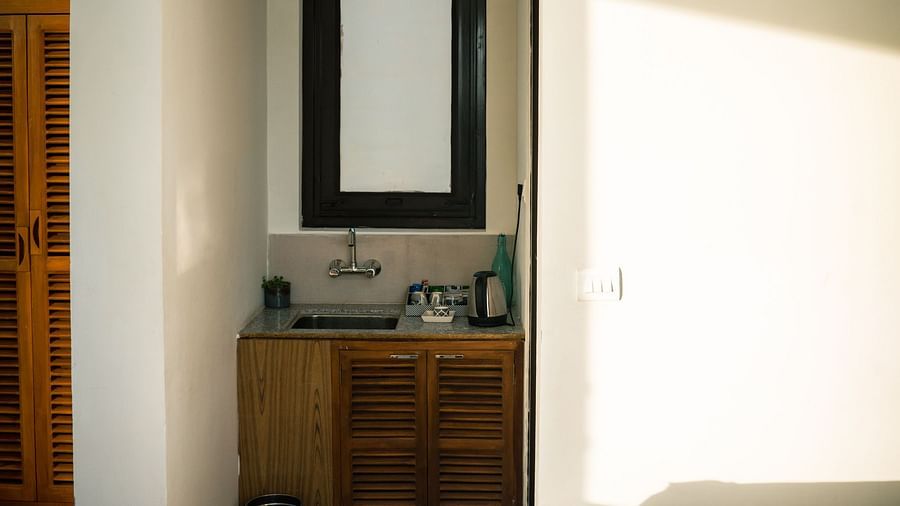 A space with a mirror, basin, and a tea and coffee maker at BluSalzz Escapade Resort, Lansdowne
