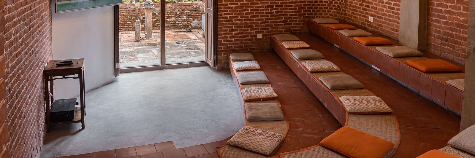 A seating area beautifully decorated with subtle lights - The Nanee
