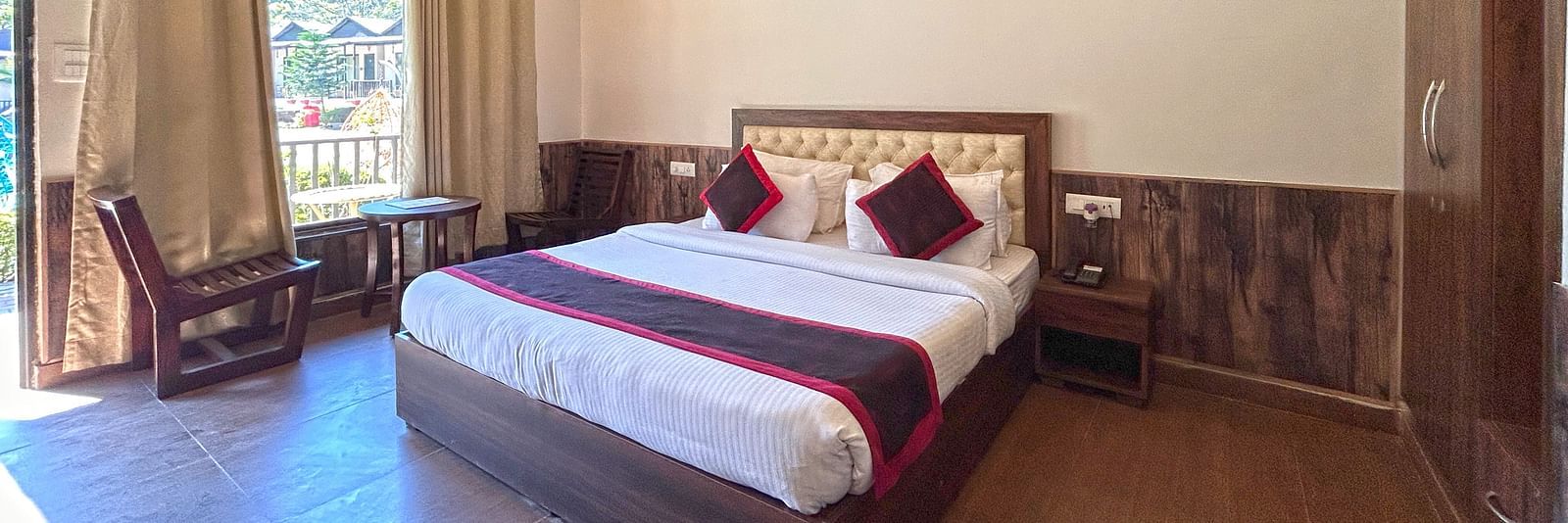 Luxury Cottage with a large bed at DLS MJ River Resort, Rishikesh.