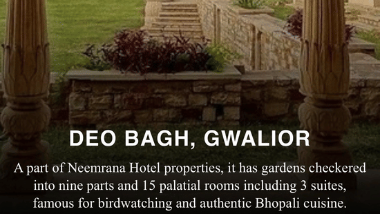 Arched stone pavilion overlooking manicured gardens at Deo Bagh, Gwalior, a heritage Neemrana hotel property.