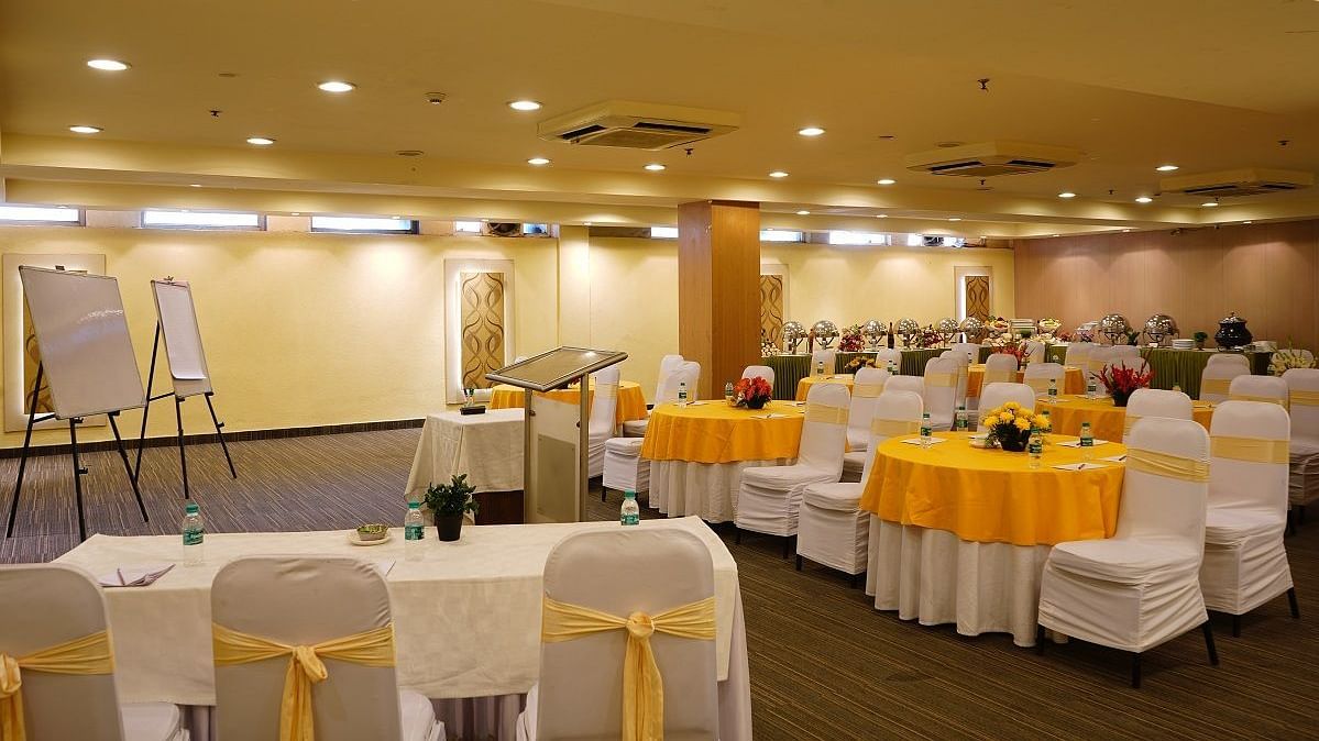 yellow and white chairs at our banquet hall at Shervani Nehru Place, New Delhi 2