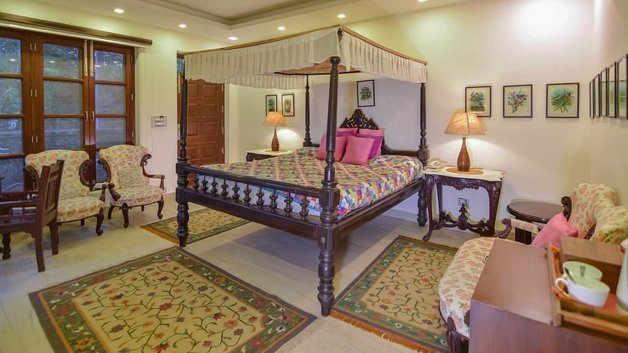 Image of interior of a Hotel Room with bed at Shaheen Bagh Resort Dehradun