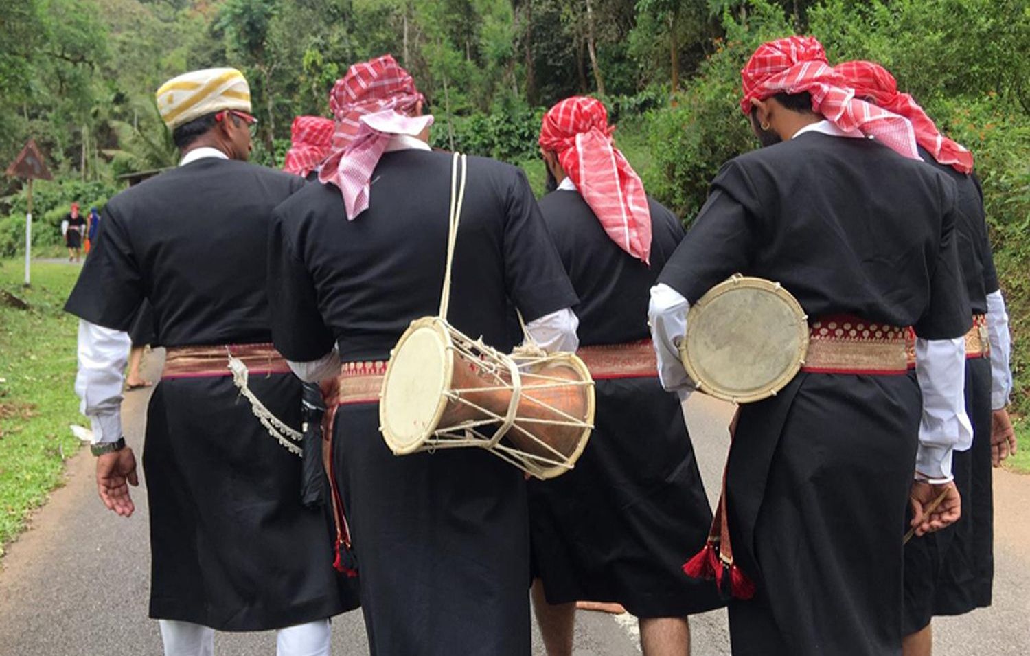 Kodava men in traditional attire with drums in Coorg.
