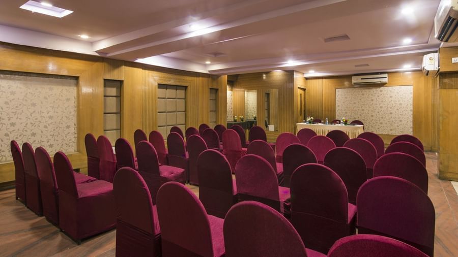 Conference room at Lords Eco Inn Dahej with theatre-style seating and modern presentation setup.