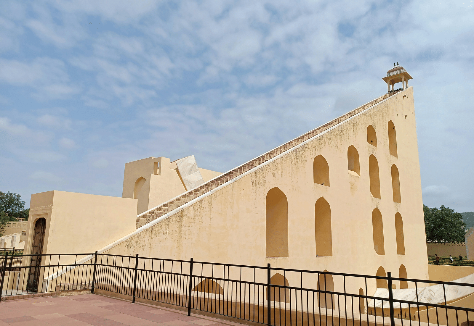 image of the Jantar mantar in jaipur on a bright day with a cloudy sky in the backdrop