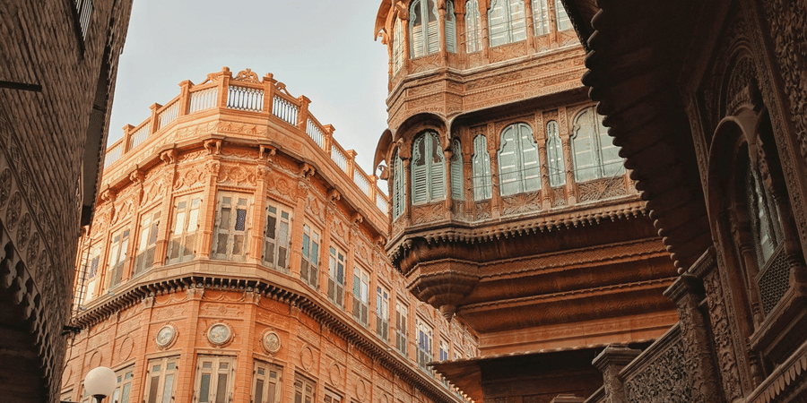 Rampuria Haveli in Bikaner, Rajasthan featuring symmetrical buildings standing next to each other which has ancient architectural designs.