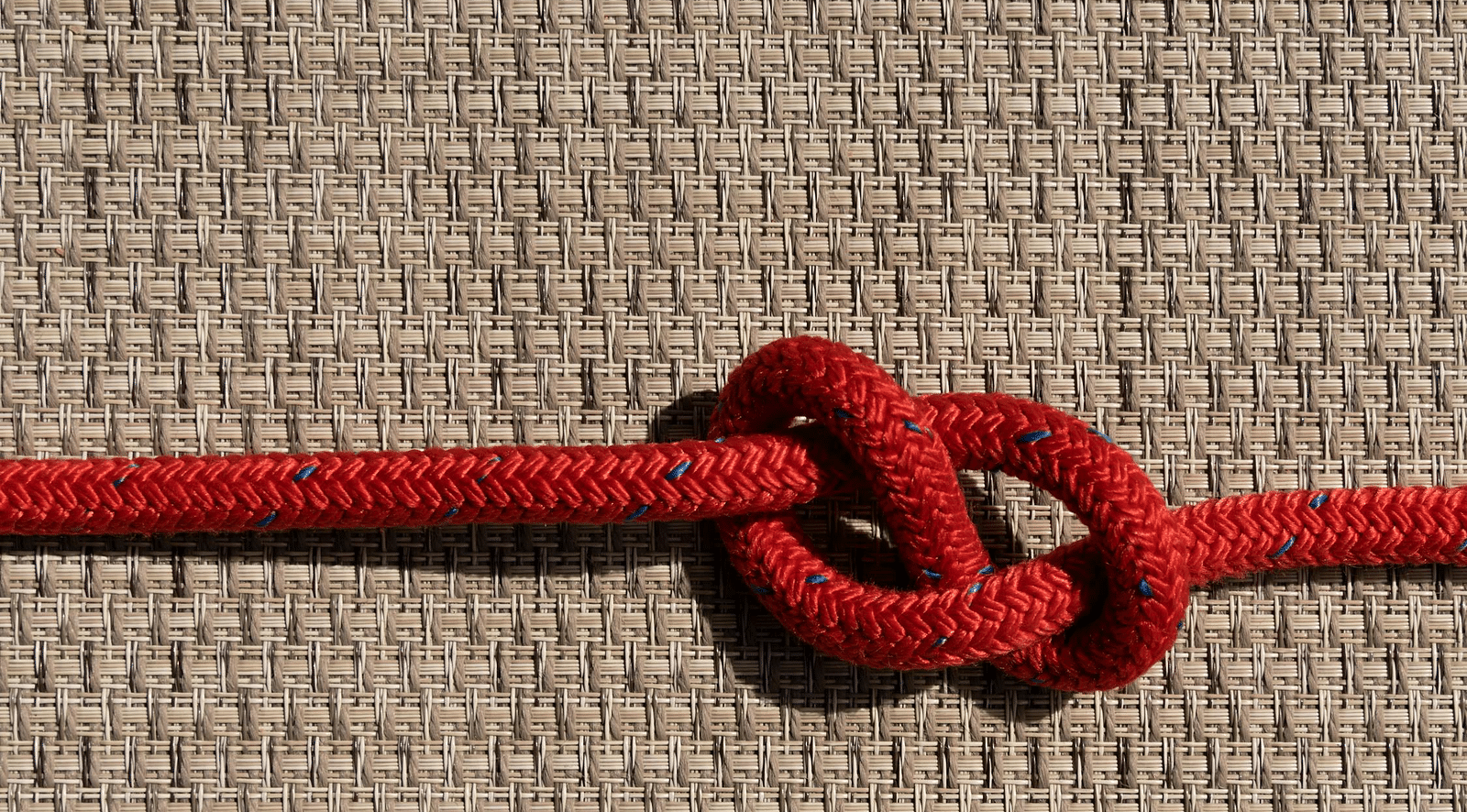 Top view of a rope tied in a knot.
