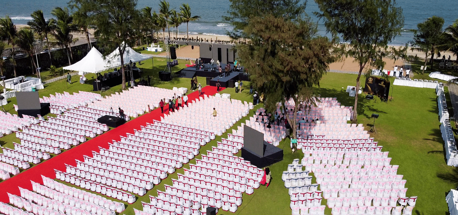 An aerial view of the beach side lawn setup in theatre style for an event at Grande Bay Resort & Spa, Mamallapuram.