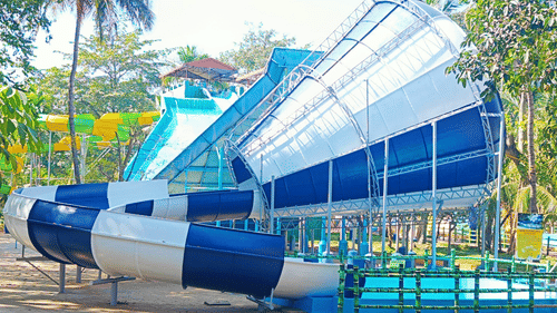 Mini Hurricane water slide at Black Thunder Water Theme Park, surrounded by greenery