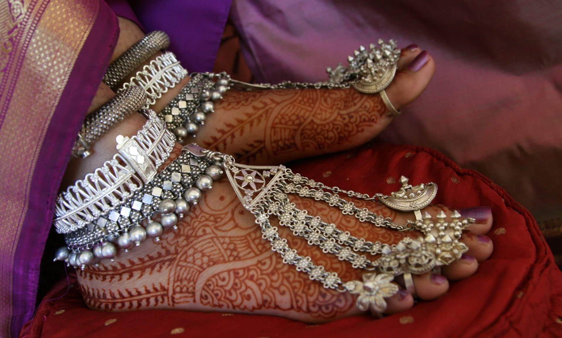 Kodava bride's feet adorned with silver anklets and henna.