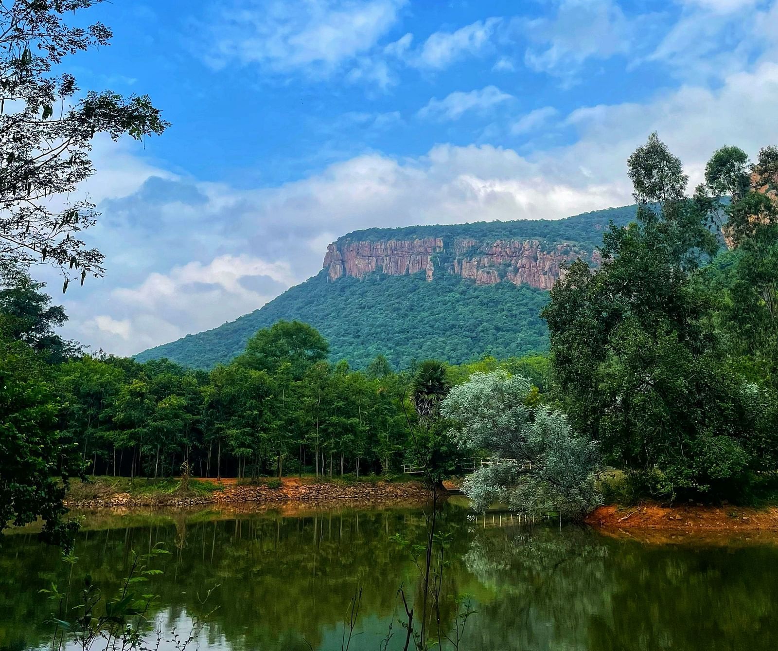 Picture featuring a water body and mountains in the background.