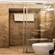  Hotel Devnadi, Haridwar | A bathroom with a toilet seat, a sink, a mirror, and lights.